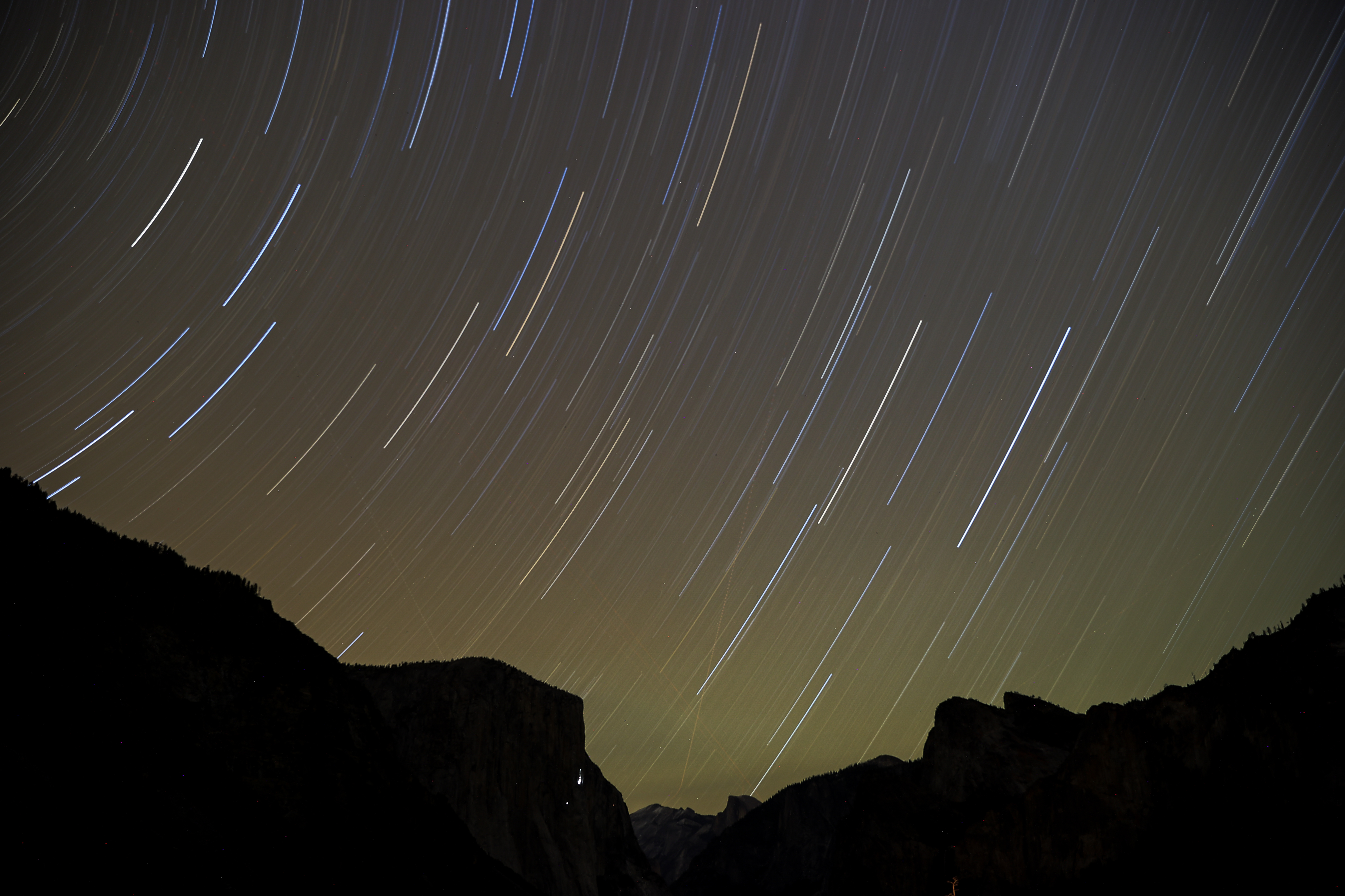 The Geminid meteor shower appearing as long streaks in the night sky above Yosemite National Park in California.