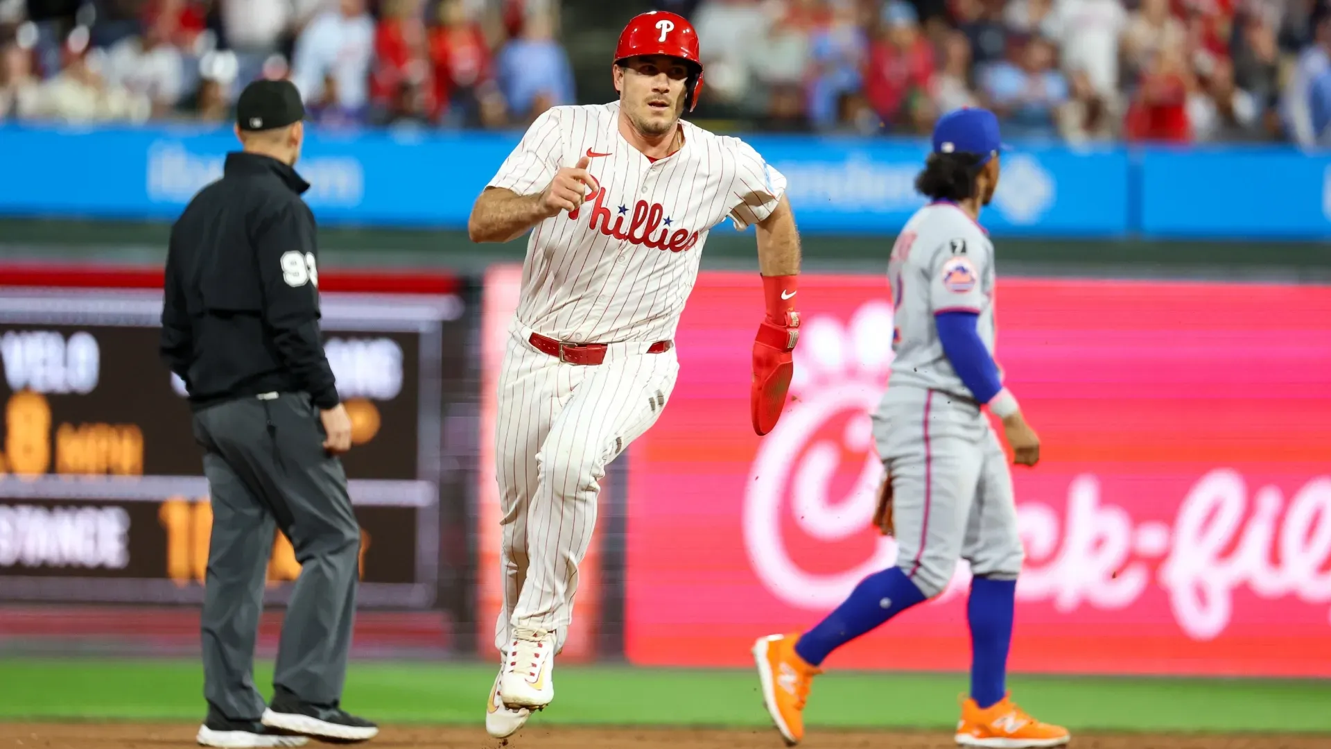 J.T. Realmuto #10 of the Philadelphia Phillies runs to third base. Isaiah Vazquez/Getty Images