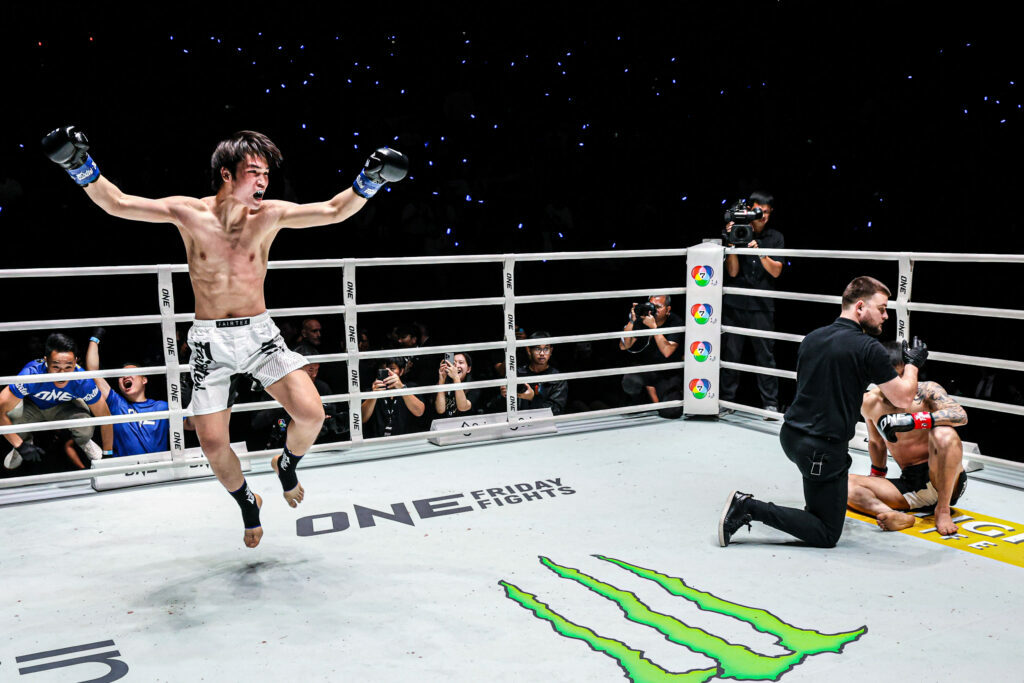 Chinese kickboxer Liu Mengyang celebrates his win in the ring, while the referee checks on Tawanchai at ONE Friday Fights 137