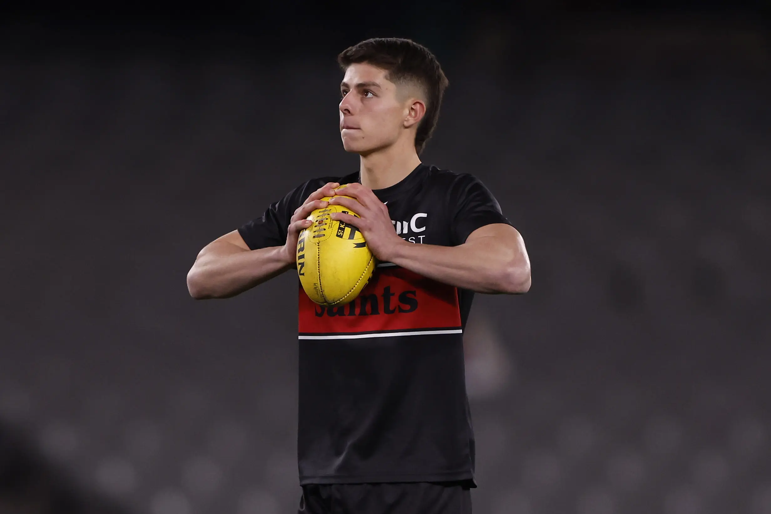 MELBOURNE, AUSTRALIA - AUGUST 04: Angus McLennan of the Saints warms up before the round 21 AFL match between St Kilda Saints and Brisbane Lions at Marvel Stadium, on August 04, 2024, in Melbourne, Australia. (Photo by Darrian Traynor/Getty Images)