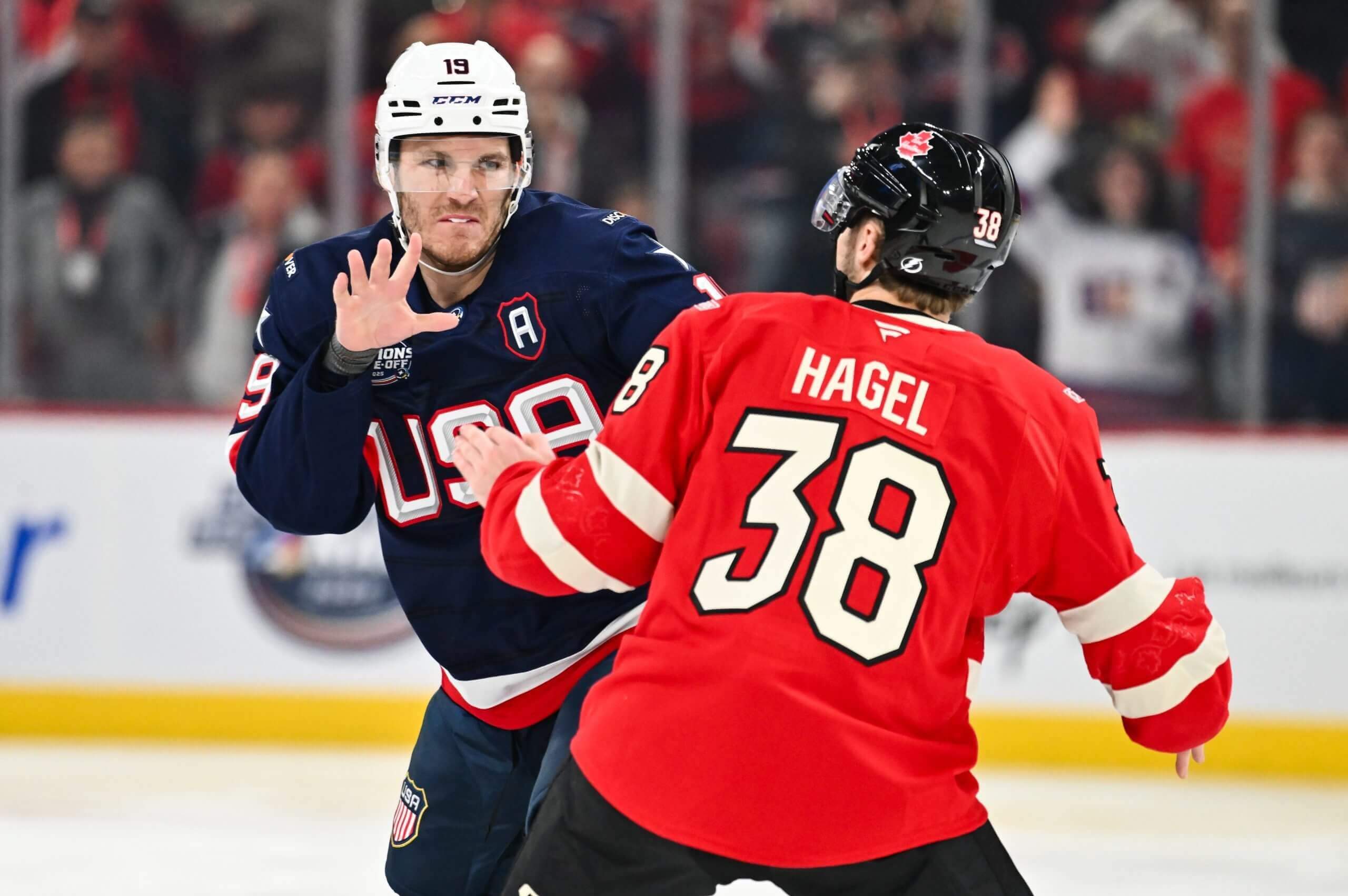 Matthew Tkachuk and Brandon Hagel prepare to throw punches during a 4 Nations Face-Off game between the US and Canada.