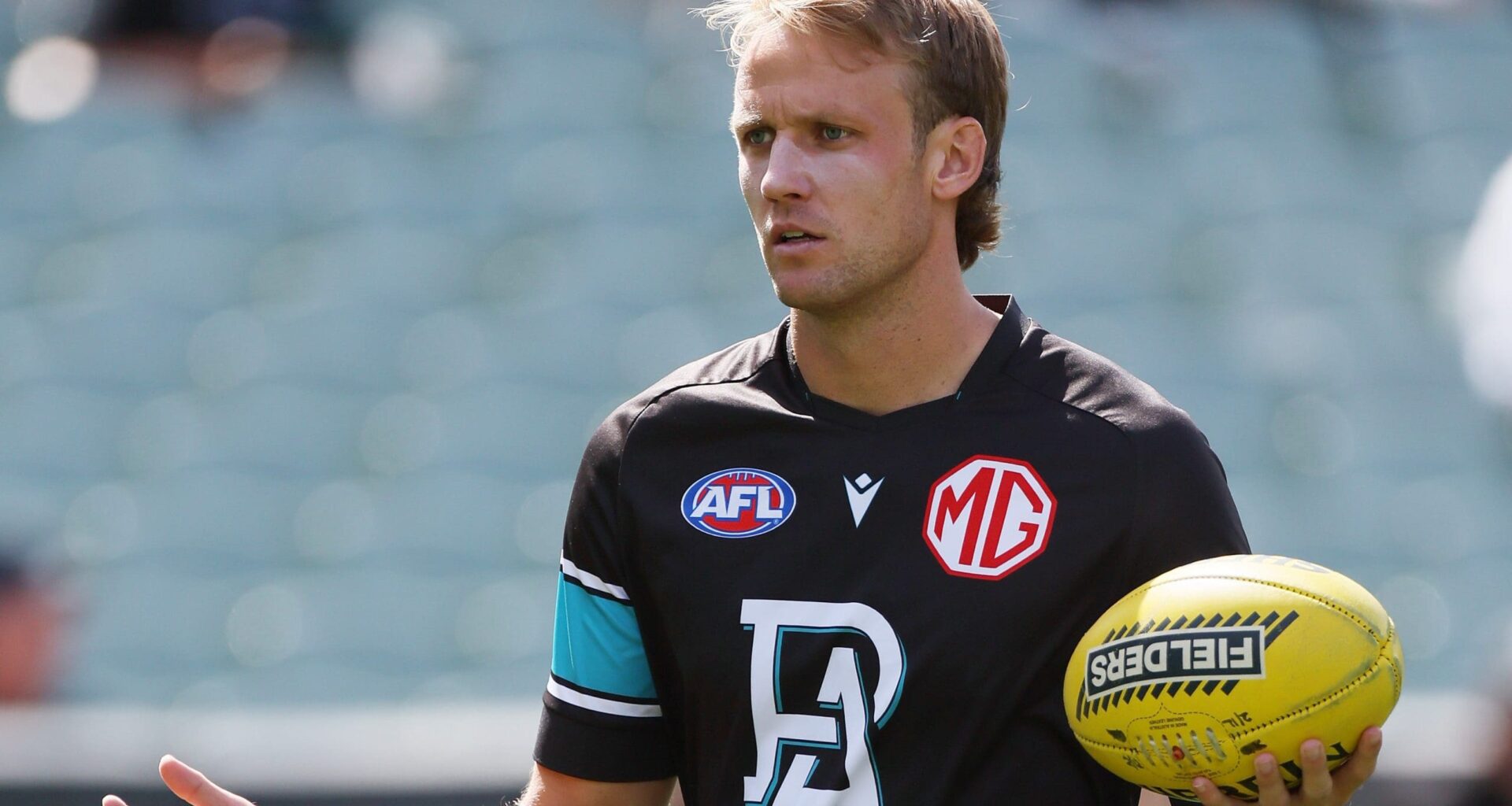 ADELAIDE, AUSTRALIA - MARCH 22: Jack Lukosius of the Power warms up during the 2025 AFL Round 02 match between the Port Adelaide Power and the Richmond Tigers at Adelaide Oval on March 22, 2025 in Adelaide, Australia. (Photo by James Elsby/AFL Photos via Getty Images)
