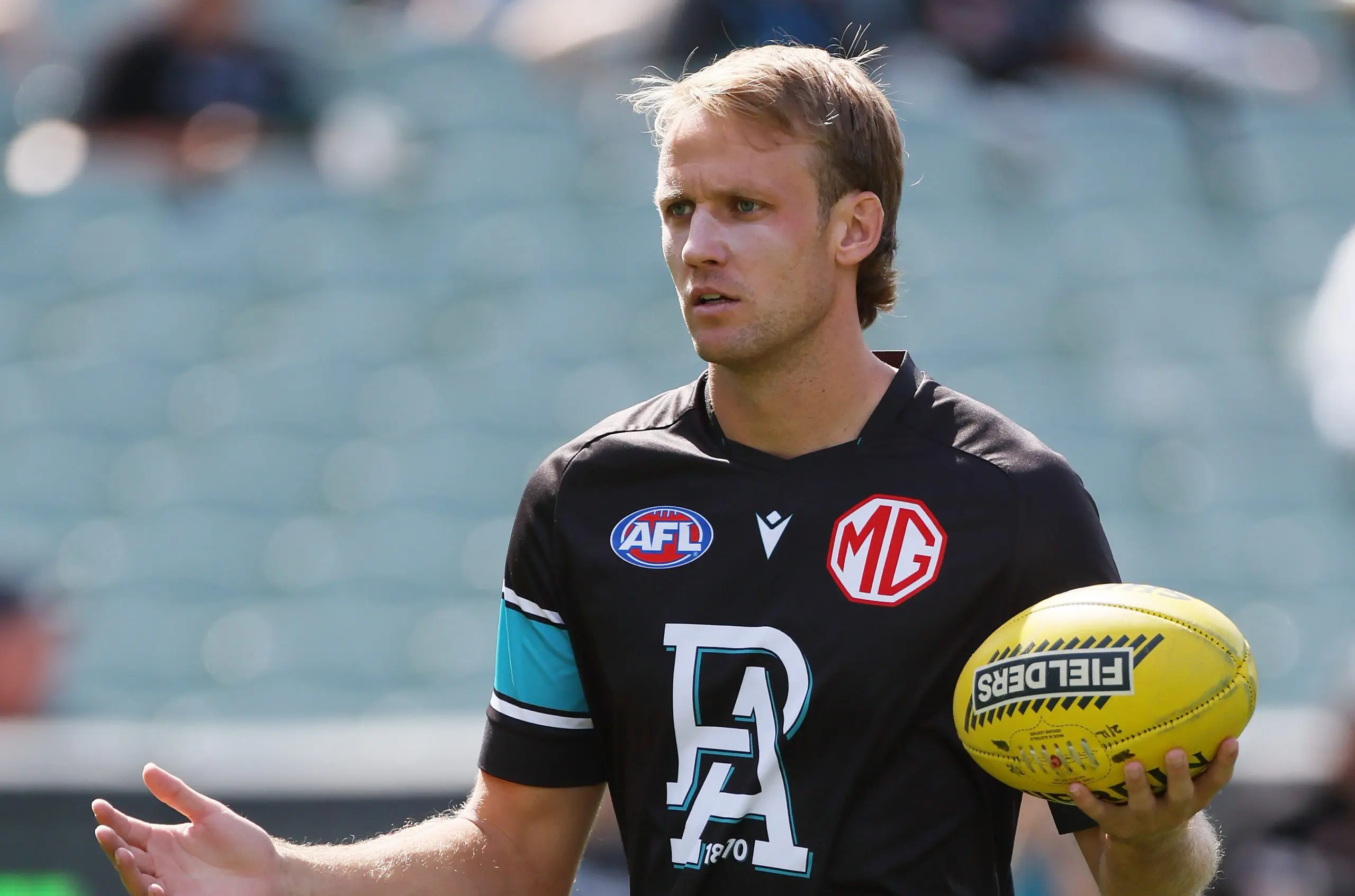 ADELAIDE, AUSTRALIA - MARCH 22: Jack Lukosius of the Power warms up during the 2025 AFL Round 02 match between the Port Adelaide Power and the Richmond Tigers at Adelaide Oval on March 22, 2025 in Adelaide, Australia. (Photo by James Elsby/AFL Photos via Getty Images)