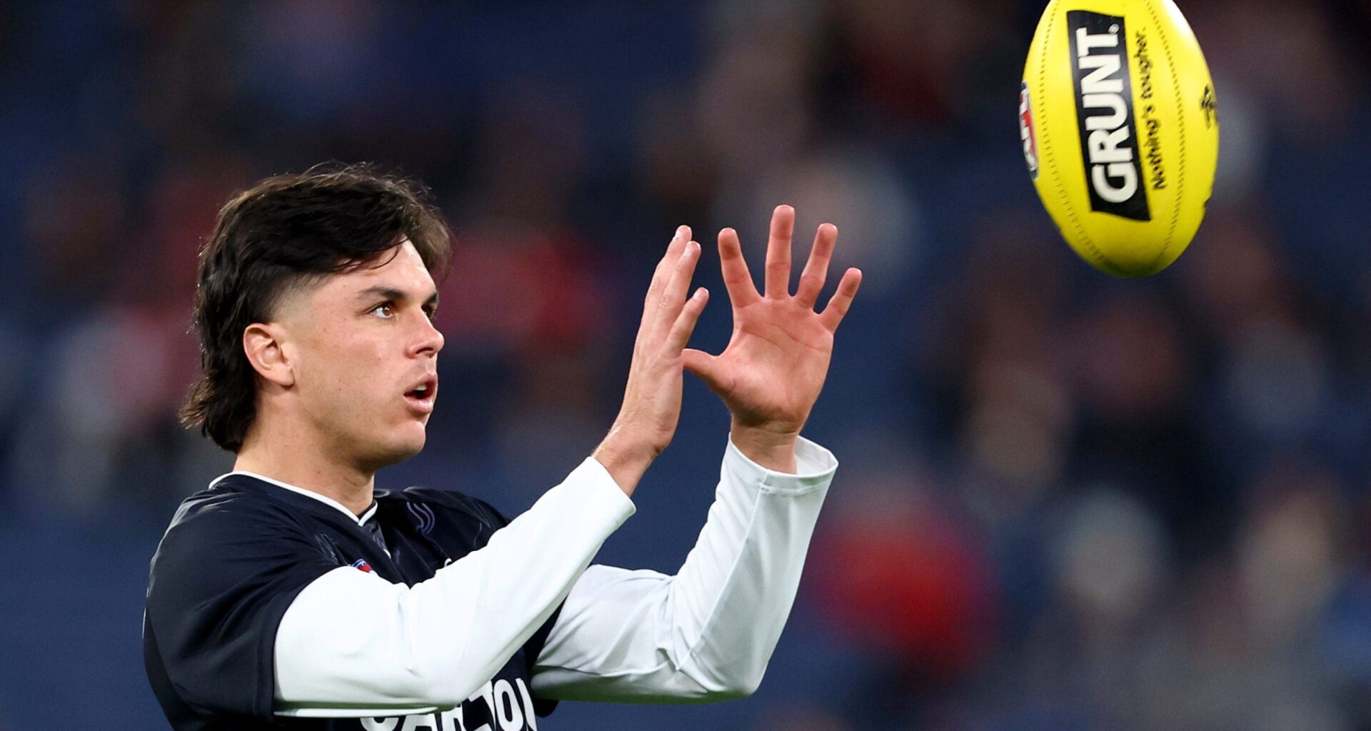 MELBOURNE, AUSTRALIA - MAY 09: Elijah Hollands of the Blues warms up ahead of the round nine AFL match between St Kilda Saints and Carlton Blues at Melbourne Cricket Ground, on May 09, 2025, in Melbourne, Australia. (Photo by Josh Chadwick/AFL Photos/Getty Images)