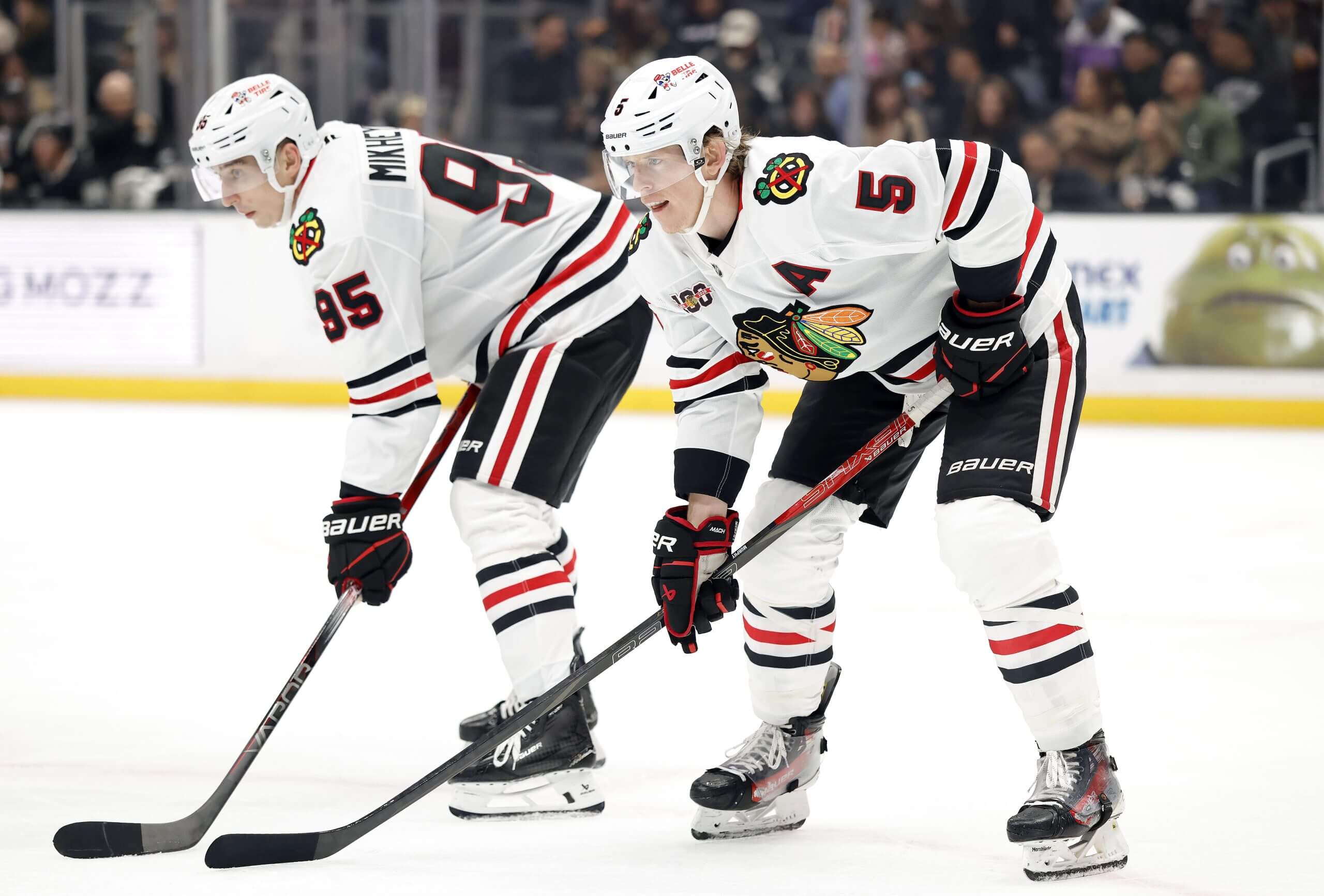 Ilya Mikheyev and Connor Murphy prepare for a faceoff.
