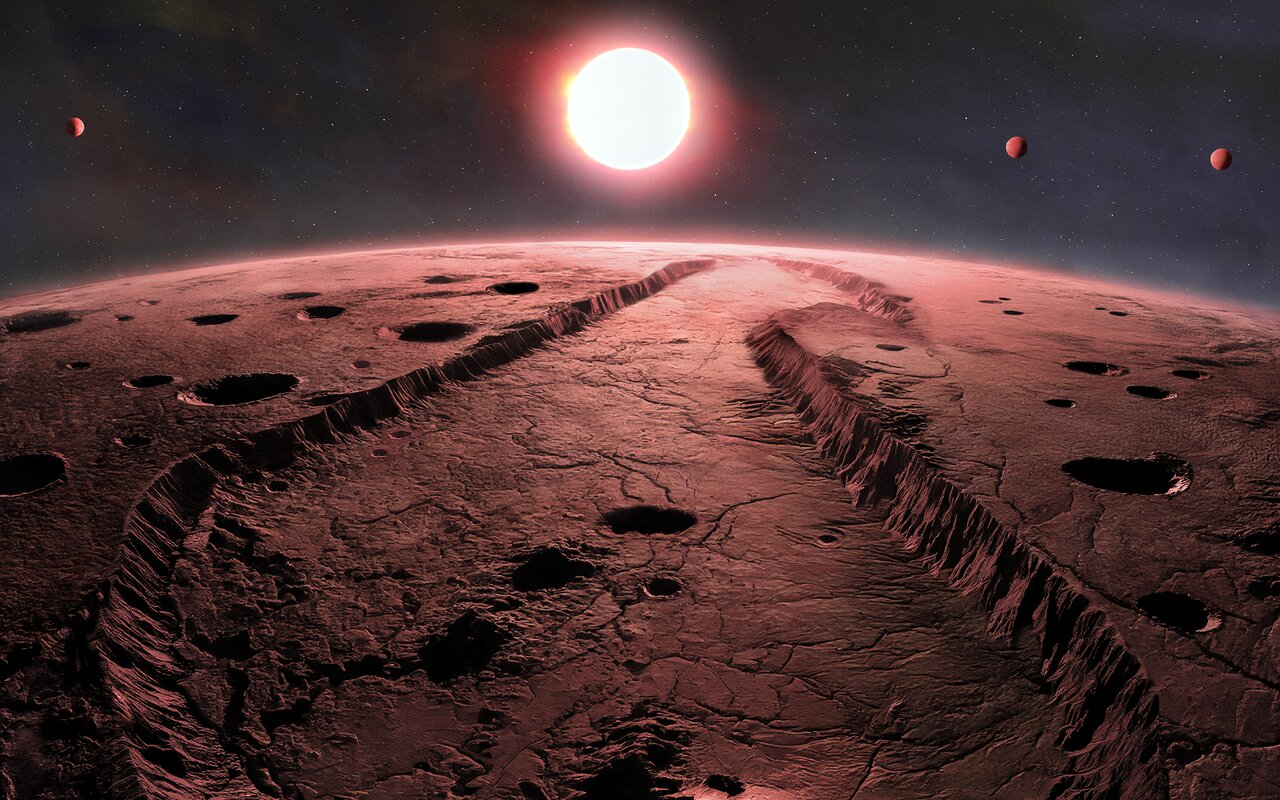 A view of a red rocky surface of an exoplanet with a bright star in the sky beyond.