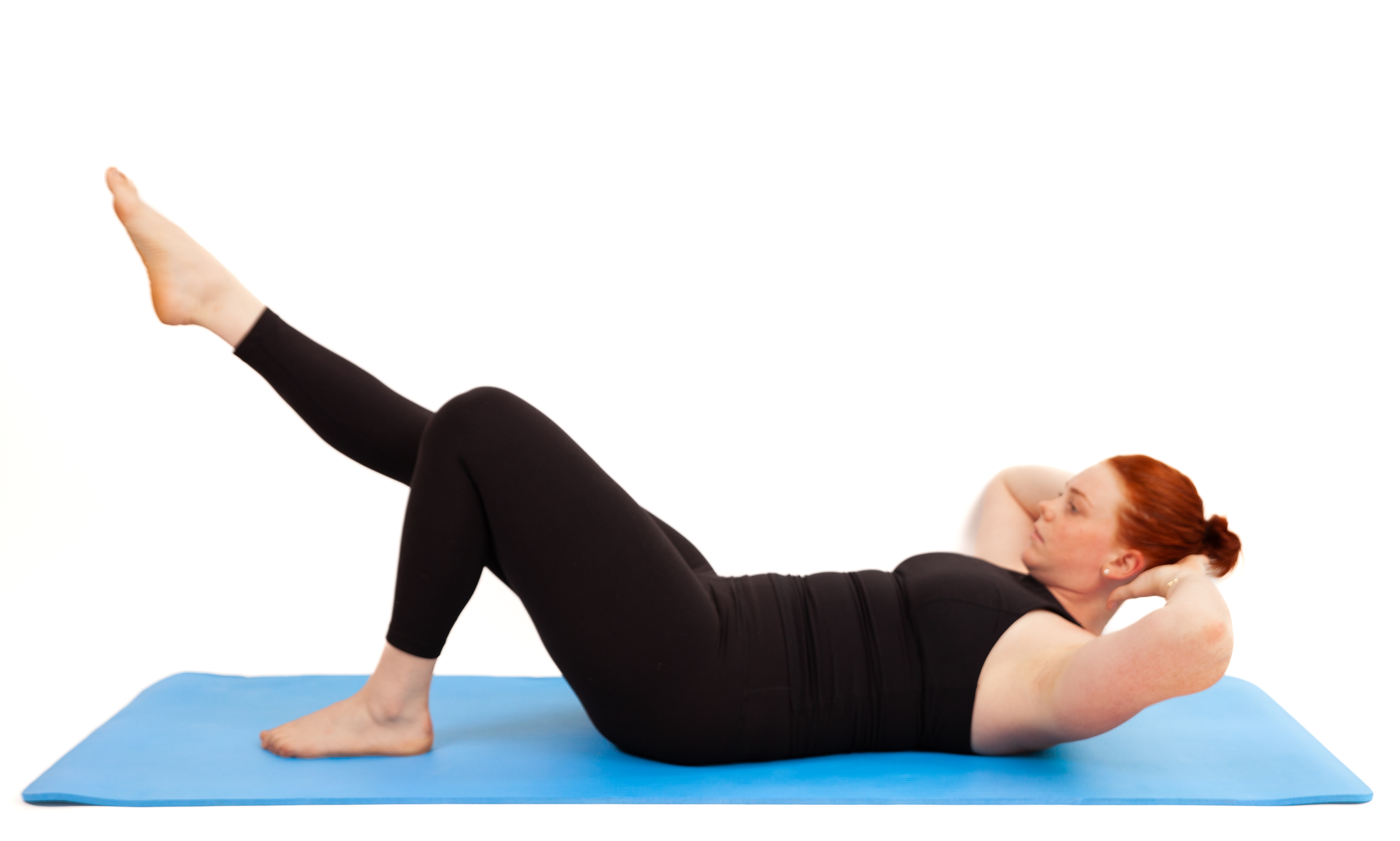 Woman demonstrates Pilates exercise on blue exercise mat against white background
