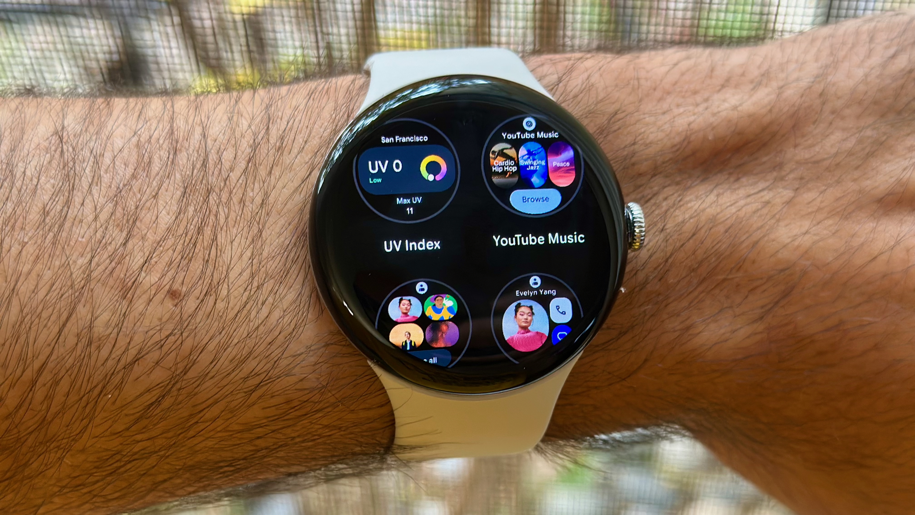 The Add Tiles view showing the UV Index, YouTube Music, and Contacts Tiles on the Google Pixel Watch 4.