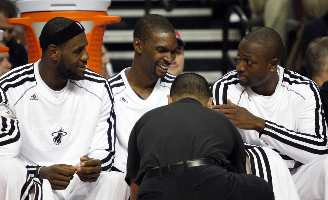 Oct 10, 2013; Auburn Hills, MI, USA; Miami Heat small forward LeBron James (left) power forward Chris Bosh (middle) and shooting guard Dwyane Wade (right) during the third quarter against the Detroit Pistons at The Palace of Auburn Hills. Heat beat the Pistons 112-107. Mandatory Credit: Raj Mehta-USA TODAY Sports