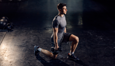 A man performing dumbbell lunges