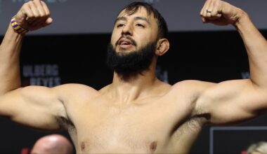 Dominick Reyes poses on the scale during the UFC Perth ceremonial weigh-in