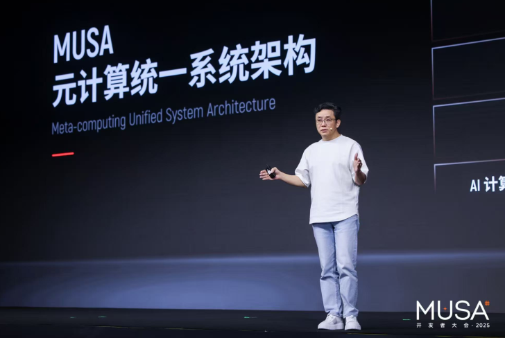 A presenter onstage at the MUSA 2025 event, with a slide displaying 'Meta-computing Unified System Architecture'.