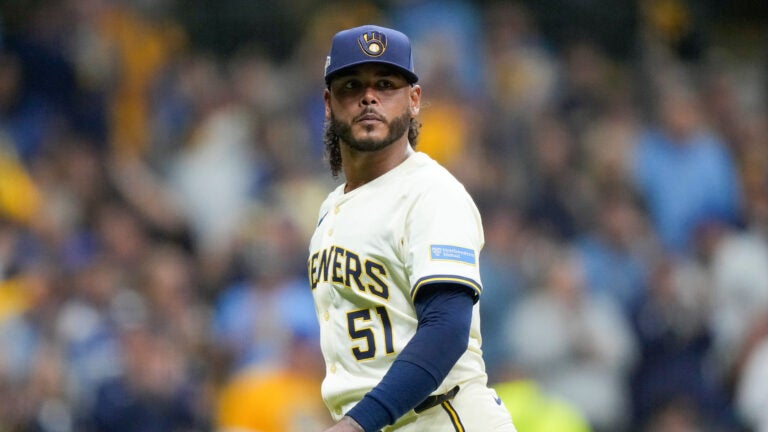 Milwaukee Brewers pitcher Freddy Peralta walks to the dugout after the top of the fifth inning in Game 2 of baseball's National League Championship Series against the Los Angeles Dodgers, Tuesday, Oct. 14, 2025, in Milwaukee.