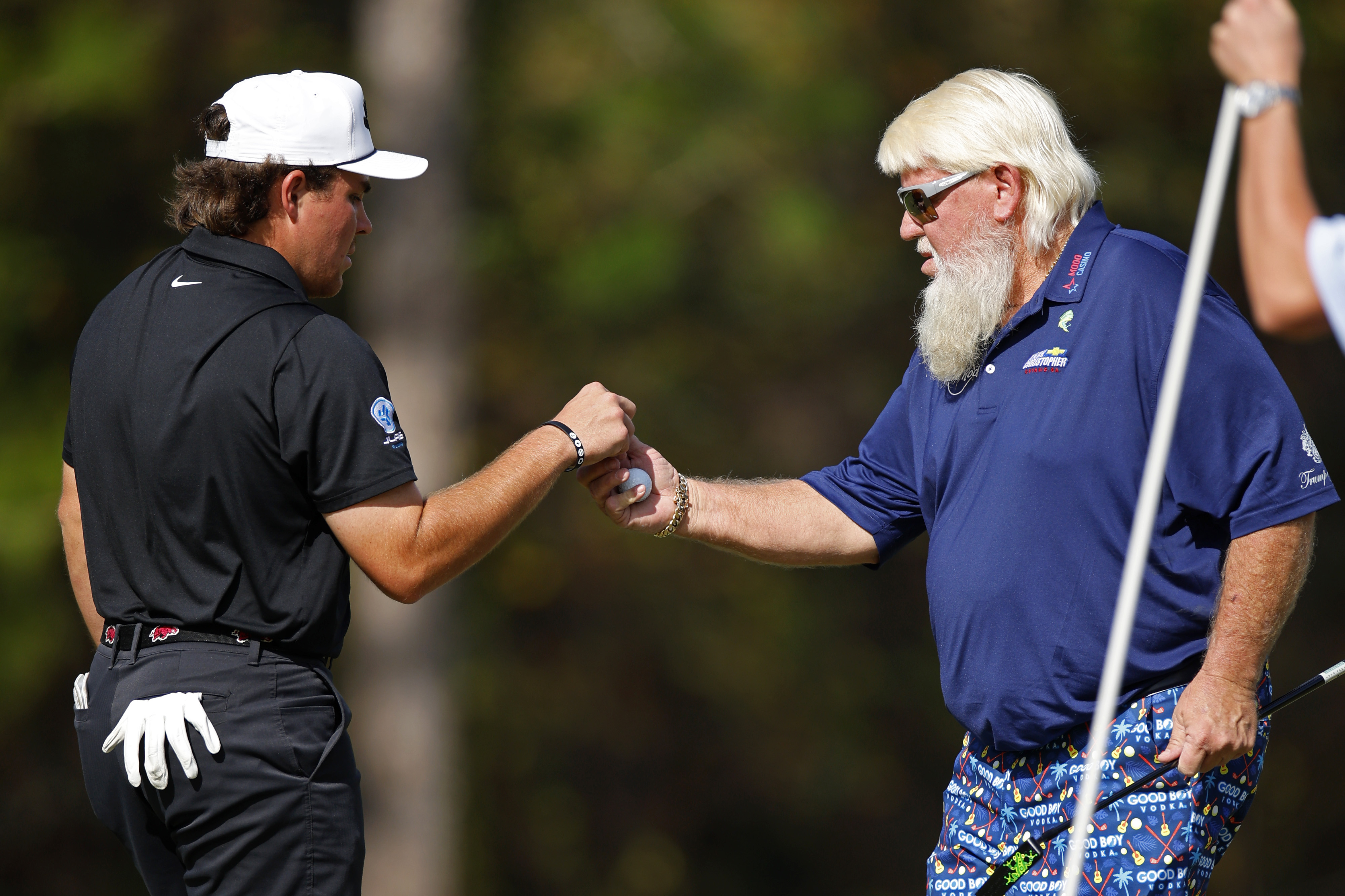 John Daly and his son fist pump