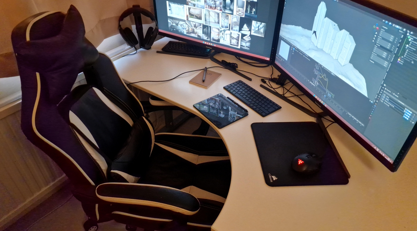digital art accessories; a gaming chair and two monitors