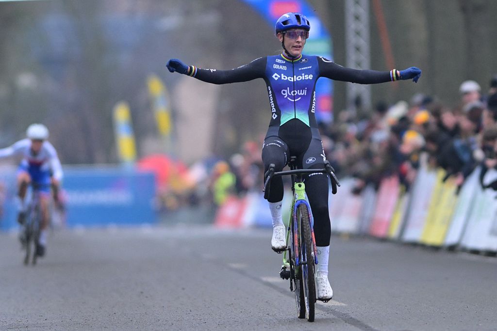 Lucinda Brand celebrates as she crosses the finish line to win the women's elite race of the Azencross