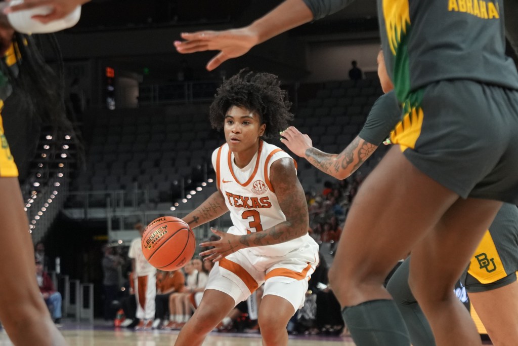 Texas guard Rori Harmon dribbles the basketball against defenders from Baylor in a recent game in December 2025.