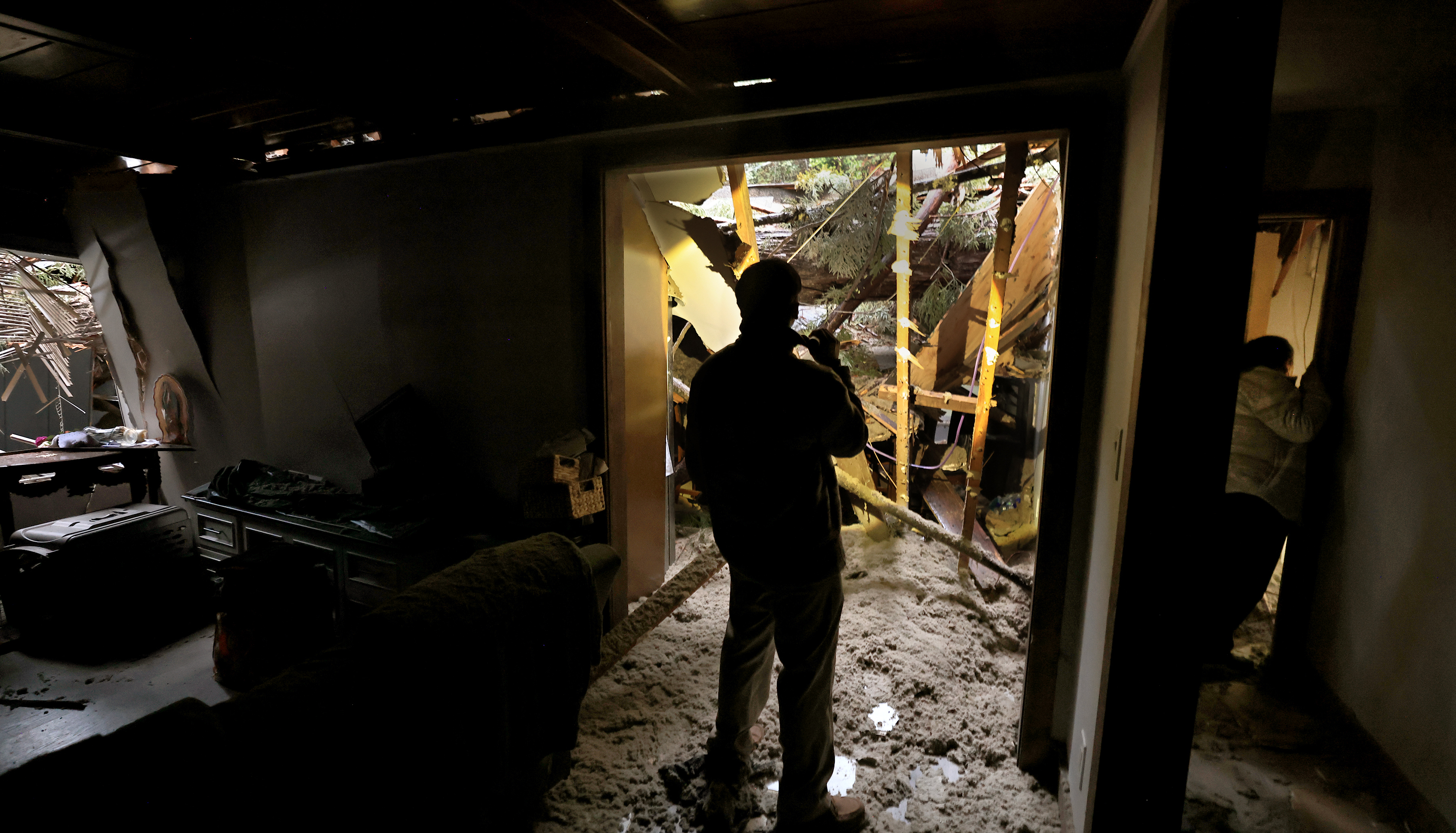 Diego Montano takes in the scene at his living room...