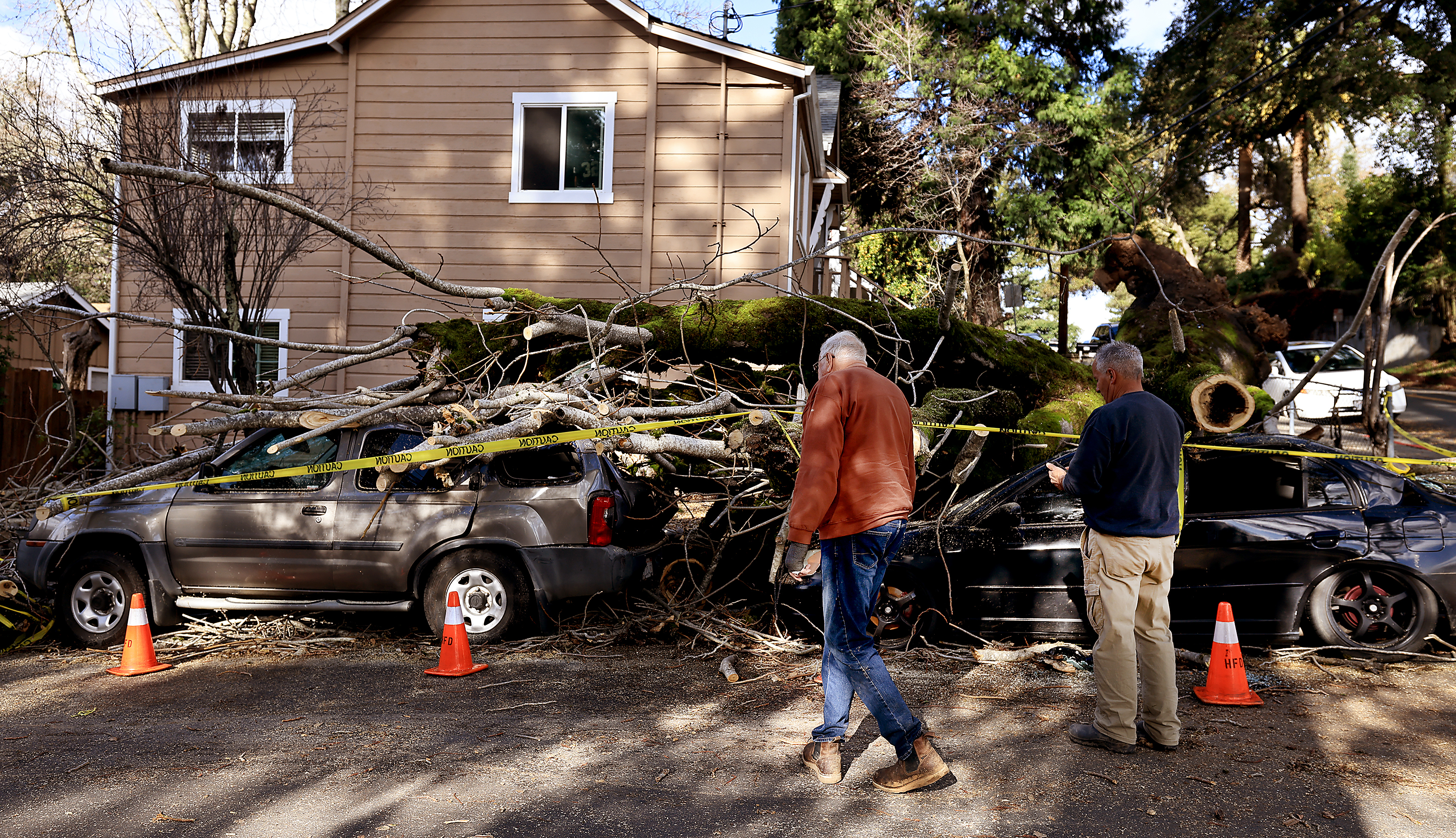 Glenn Benjamin, left, owner of a rented out property, in...