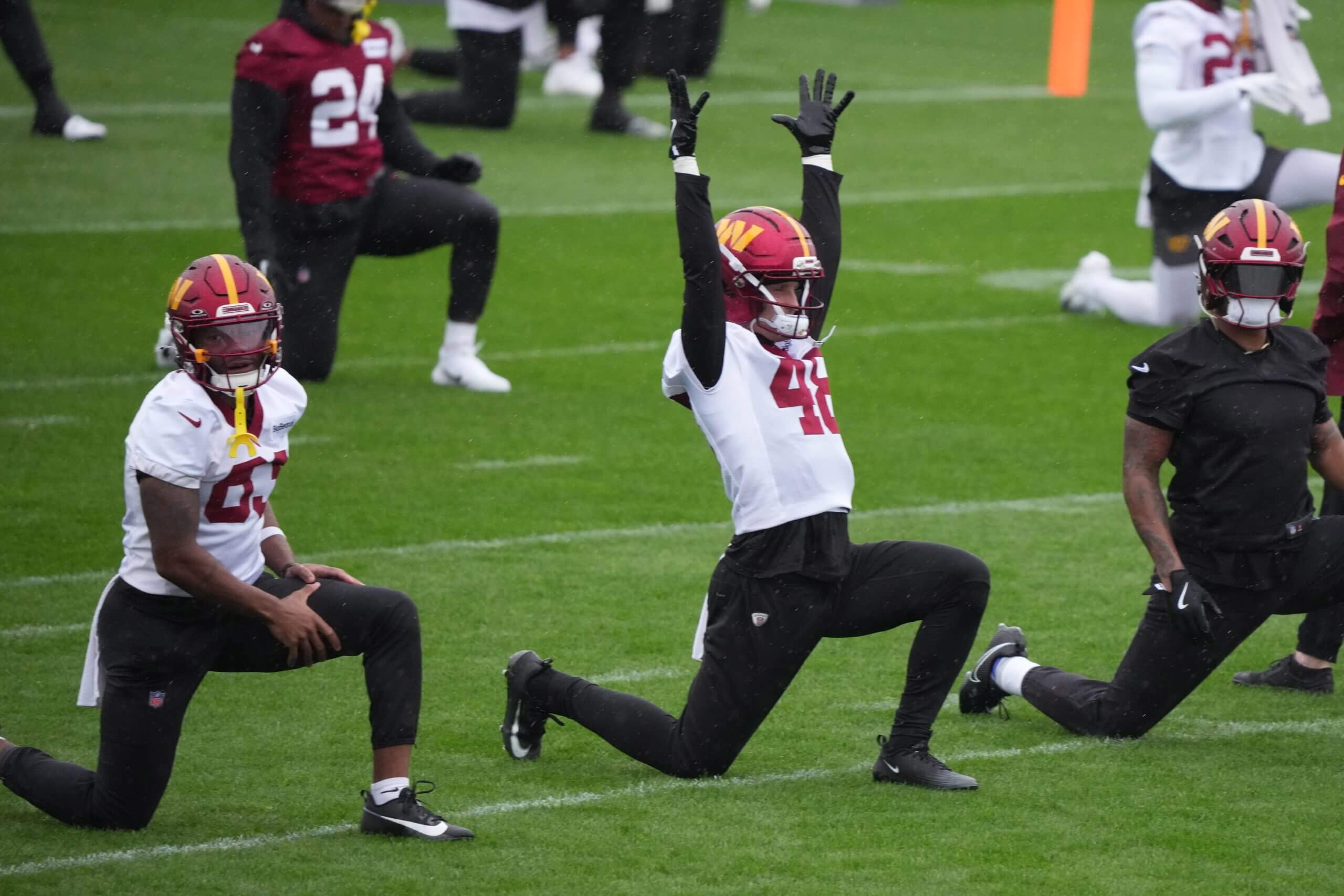 River Cracraft warms up with the Washington Commanders during a practice in Madrid.
