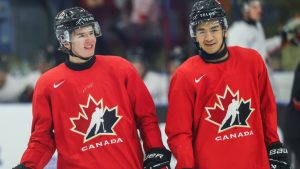 Braeden Cootes, left, of Sherwood Park, Alta., talks with Zayne Parekh, of Nobleton, Ont., during Canada's National Junior Team training camp in Niagara Falls, Ont., Tuesday, Dec. 16, 2025. THE CANADIAN PRESS/Nick Iwanyshyn