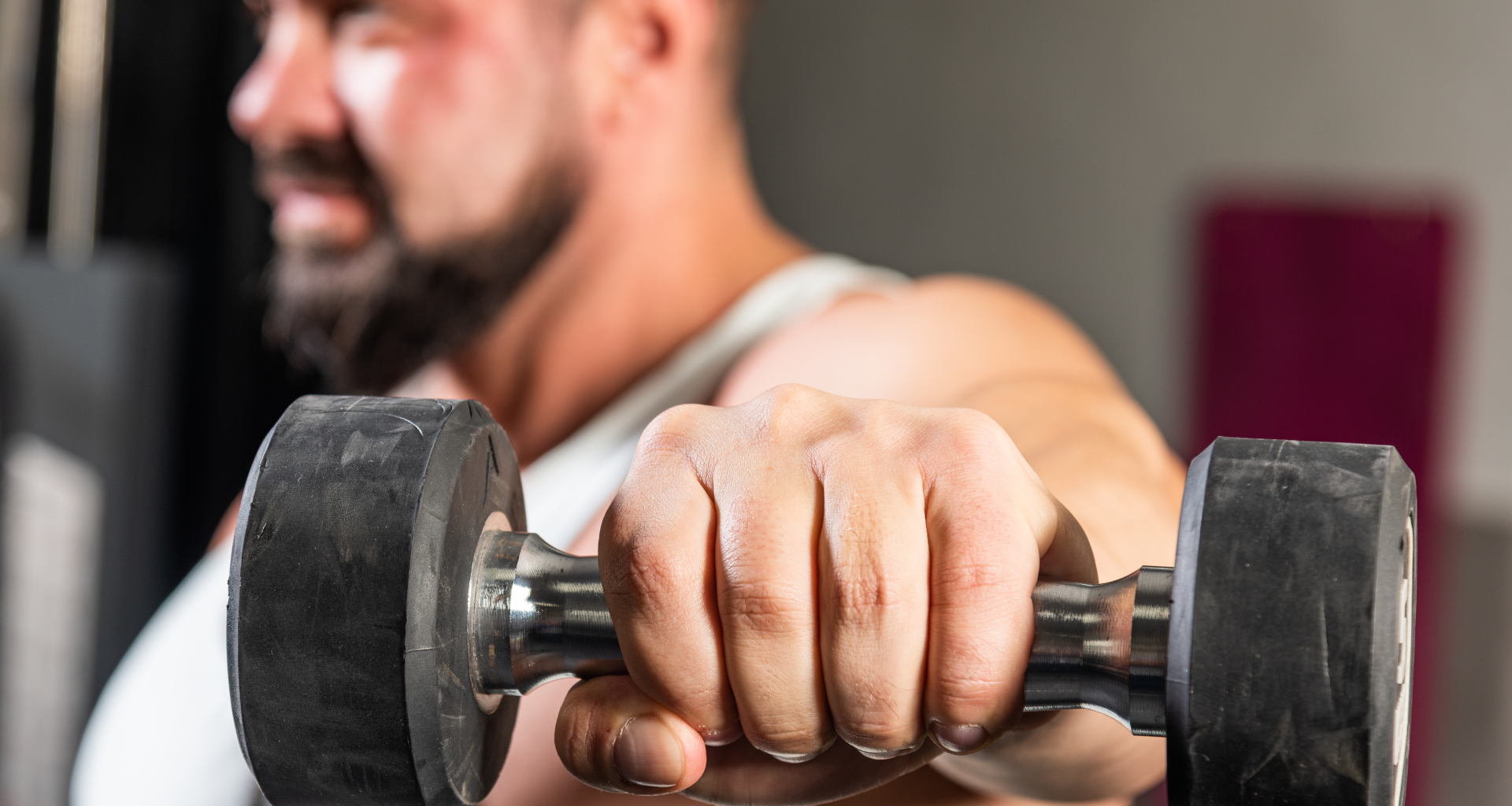 A man doing dumbbell lat raises