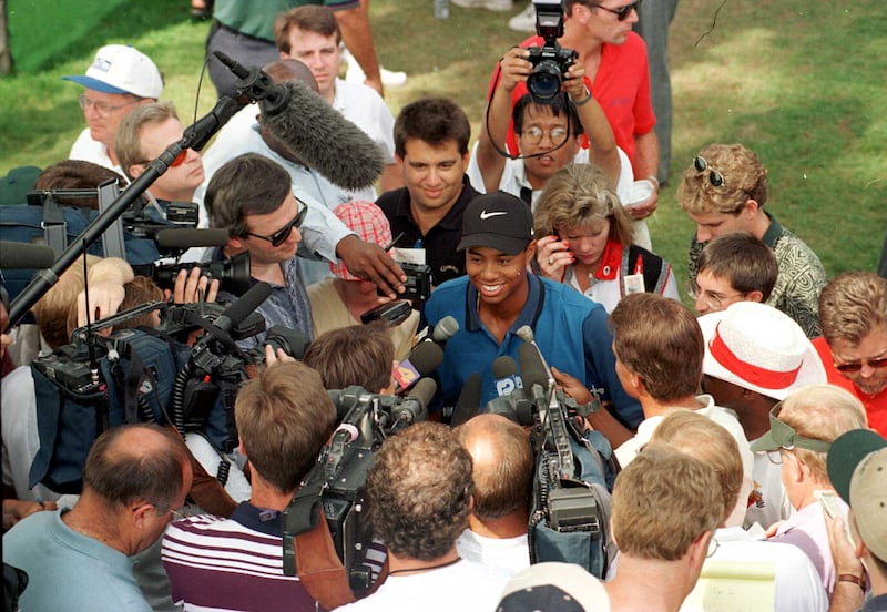 Tiger Woods speaks to the media after the third round of his professional debut at the Greater Milwaukee Open in 1996. Photograph: JD Cuban/Getty Images
