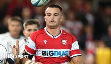 Deian Gwynne chasing the ball as it bounces above his head during a Prem rugby game against Bristol