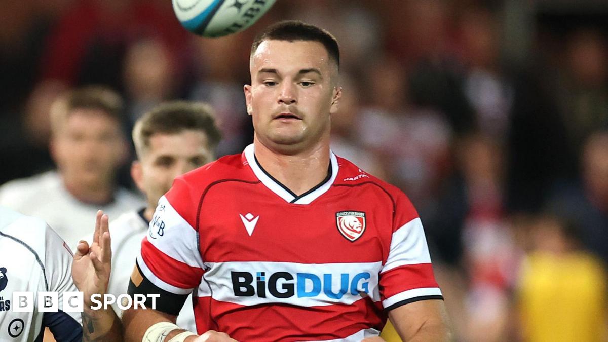 Deian Gwynne chasing the ball as it bounces above his head during a Prem rugby game against Bristol