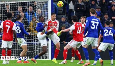 William Saliba challenges Thierno Barry for the ball