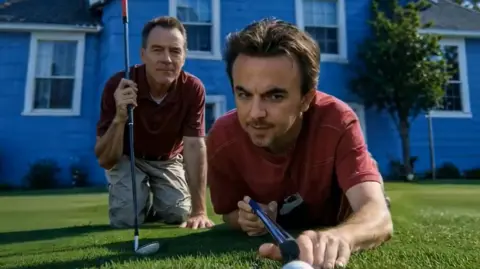 Hulu Hal and Malcom with golf clubs on the lawn of a house