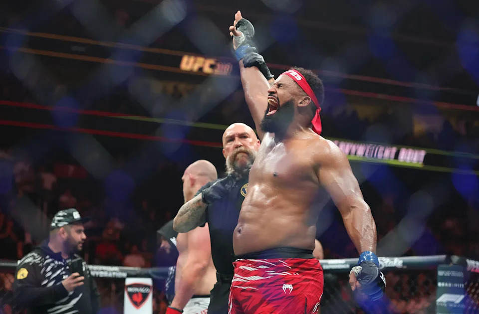 Jun 7, 2025; Newark, New Jersey, UNITED STATES; Waldo Cortes Acosta (blue gloves) reacts after defeating Serghei Spivac (red gloves) during UFC 316 at Prudential Center. Mandatory Credit: Vincent Carchietta-Imagn Images