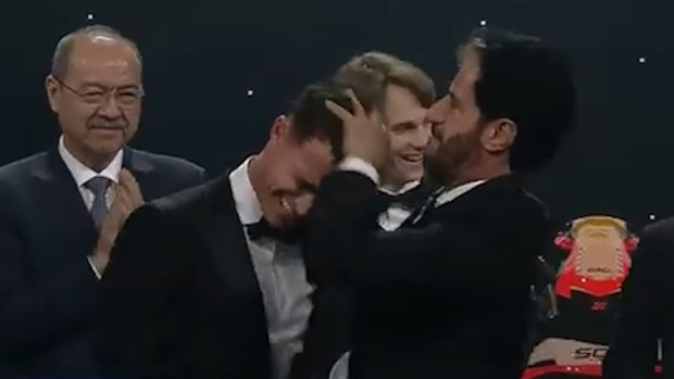 FIA president Mohammed Ben Sulayem aggressively tousles Lando Norris's hair at the FIA awards gala.