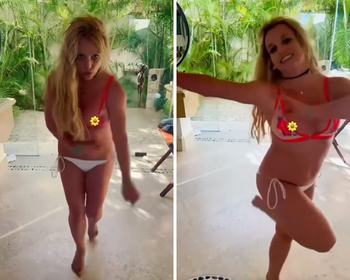 Britney Spears in a red bikini experiencing a slip and sharing a yacht kiss with a mystery man outdoors.