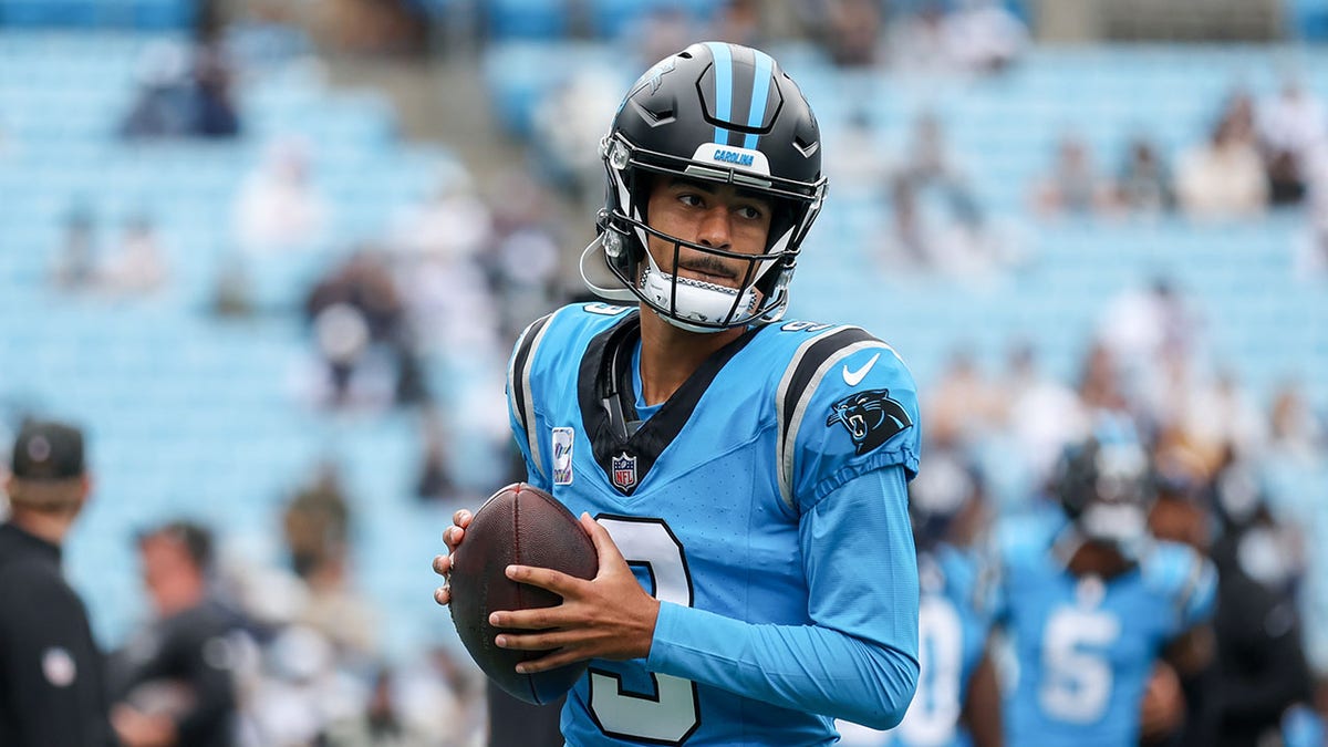 Bryce Young looks on field