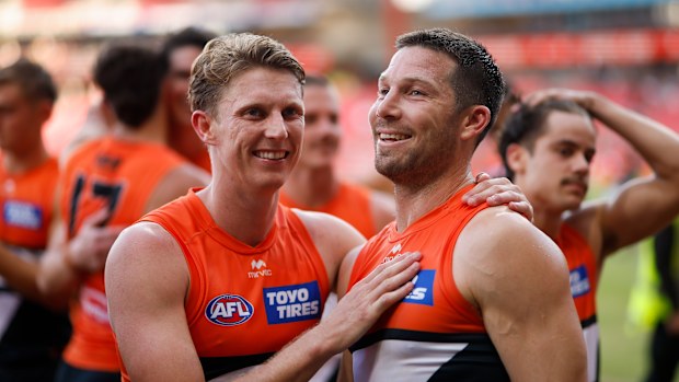 Lachie Whitfield and Toby Greene of the Giants celebrate a win together.