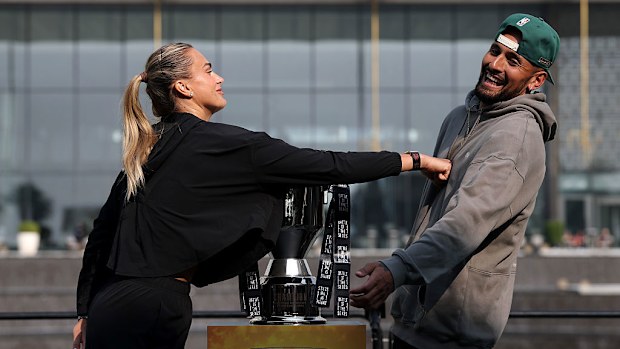 Aryna Sabalenka (L) pushes Nick Kyrgios during a press conference prior to the Battle of the Sexes match.