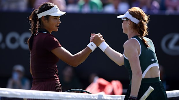 Emma Raducanu shakes hands with Maya Joint following their women's singles second-round match at the Lexus Eastbourne Open.