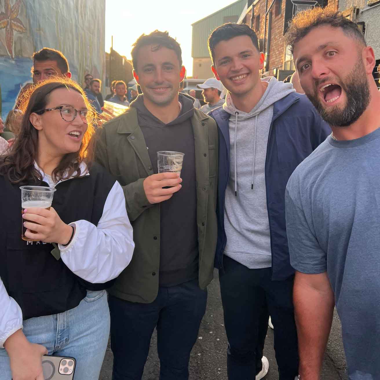 jon rahm with golf staffers in portrush