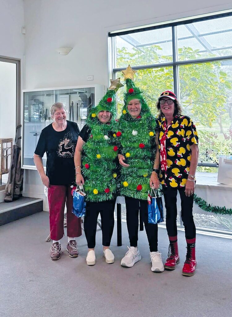 Christmas spirit is alive and well at the Lakes Entrance Golf Club with members Jenny Dowie and Di Gray recently dressing up as Christmas trees for a round. They are pictured with Anita Bertram and Sandi East. (PS)