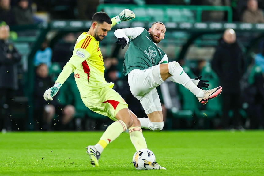 Martin Boyle leaps at a goalkeeper