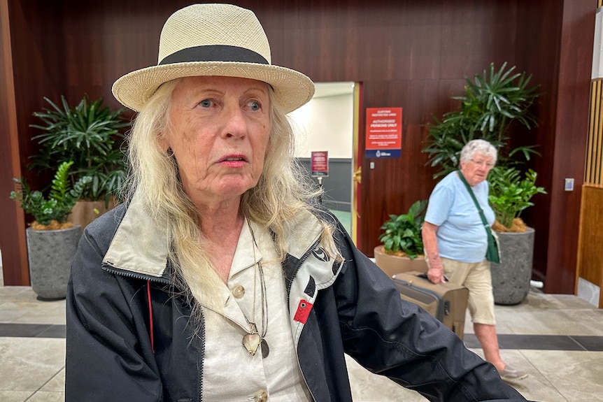 A woman wearing a straw hat. 