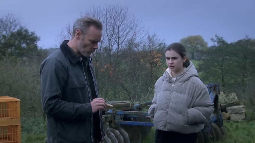 emmerdale, ray walters and april windsor outside in a field, wearing jackets