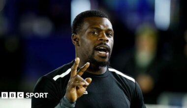 Christian Wade with his right hand up and three fingers raised in Newcastle Red Bulls training gear