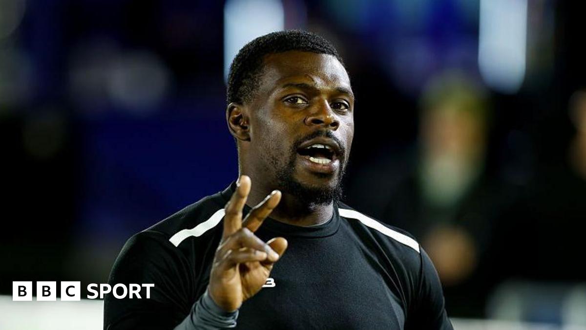 Christian Wade with his right hand up and three fingers raised in Newcastle Red Bulls training gear