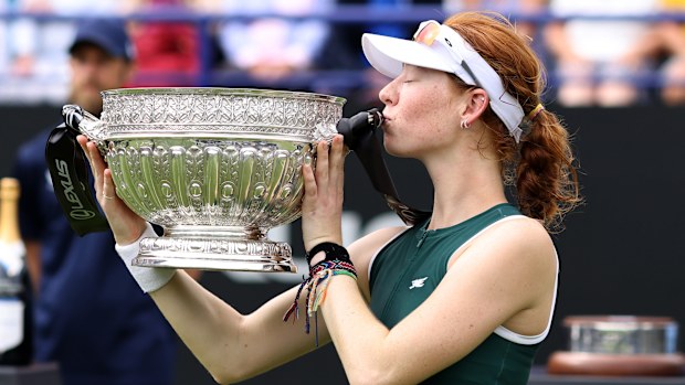 Maya Joint celebrates with the Eastbourne Open trophy after a gritty three-set victory over Alexandra Eala.