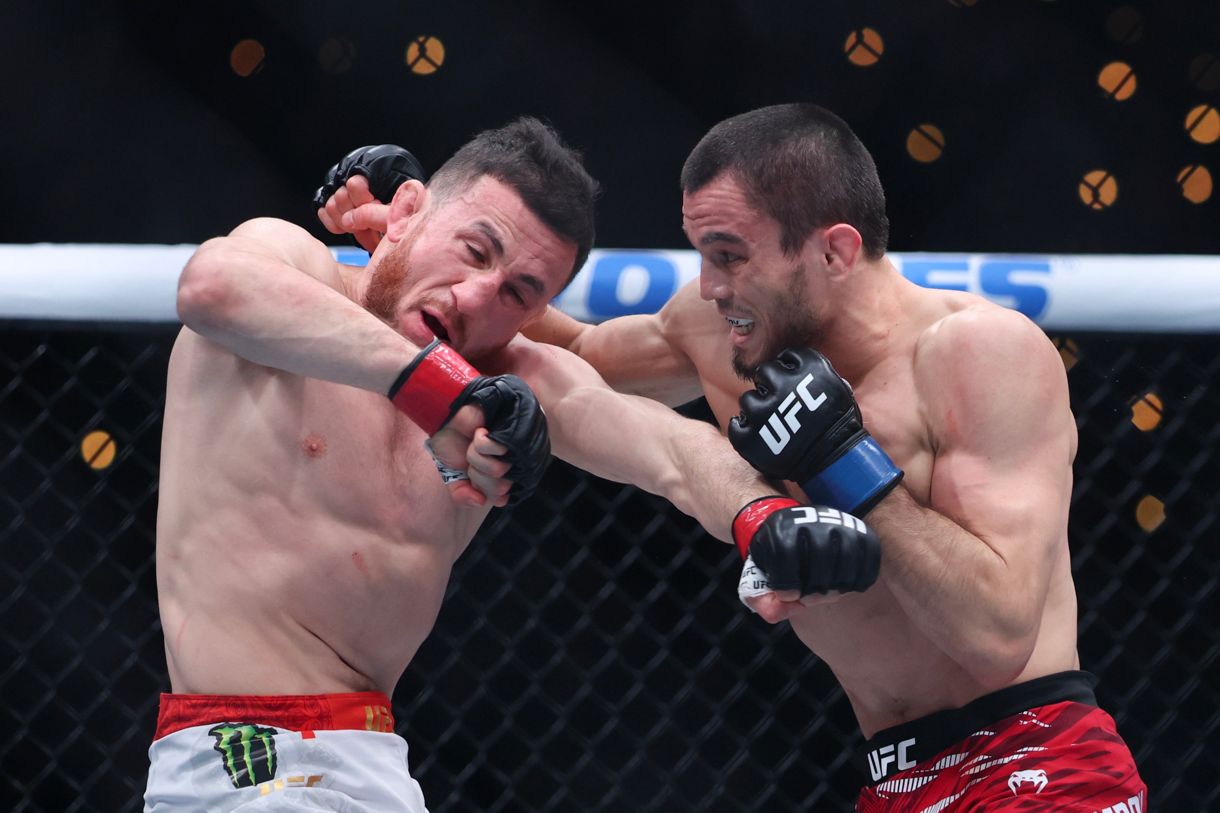 INGLEWOOD, CALIFORNIA - JANUARY 18: Merab Dvalishvili of Georgia and Umar Nurmagomedov of Russia strike each other in a bantamweight title fight during UFC 311 at Intuit Dome on January 18, 2025 in Inglewood, California. (Photo by Harry How/Getty Images)