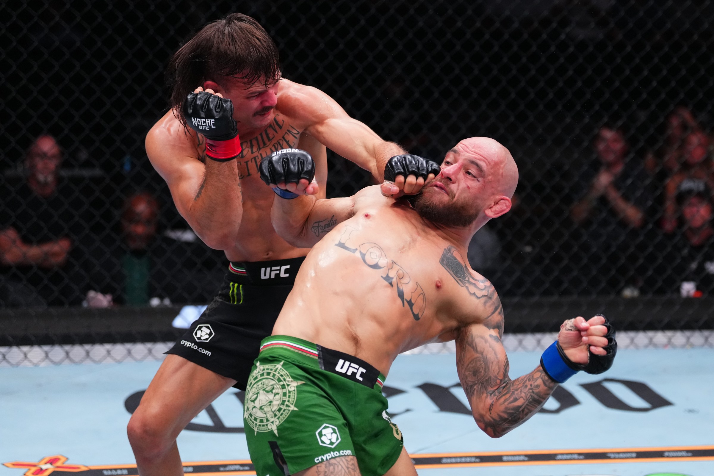 SAN ANTONIO, TEXAS - SEPTEMBER 13: (L-R) Diego Lopes of Brazil punches Jean Silva of Brazil in a featherweight fight during the Noche UFC event at Frost Bank Center on September 13, 2025 in San Antonio, Texas. (Photo by Cooper Neill/Zuffa LLC via Getty Images)