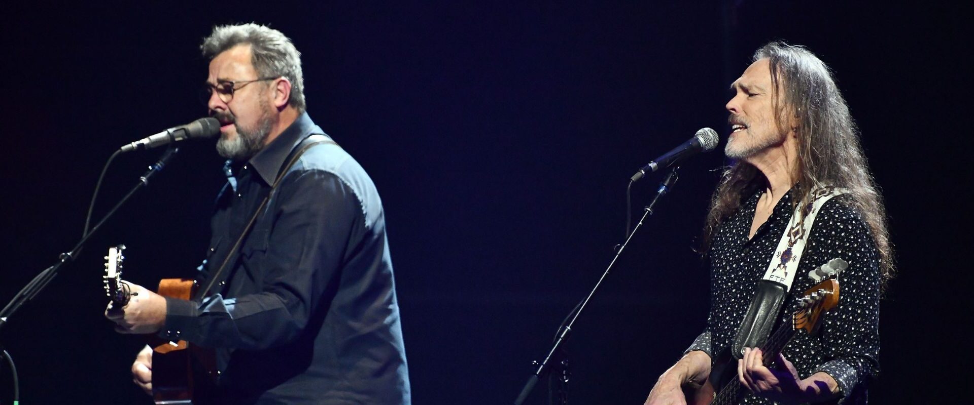 Vince Gill and Timothy B. Schmit performing with The Eagles