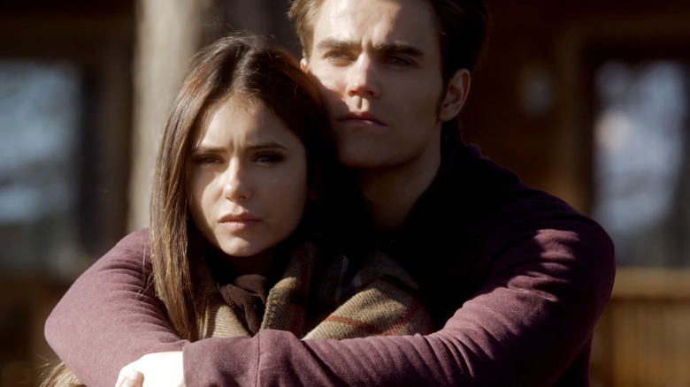 Paul Wesley's Stefan Salvatore hugging Nina Dobrev's Elena Gilbert in The Vampire Diaries